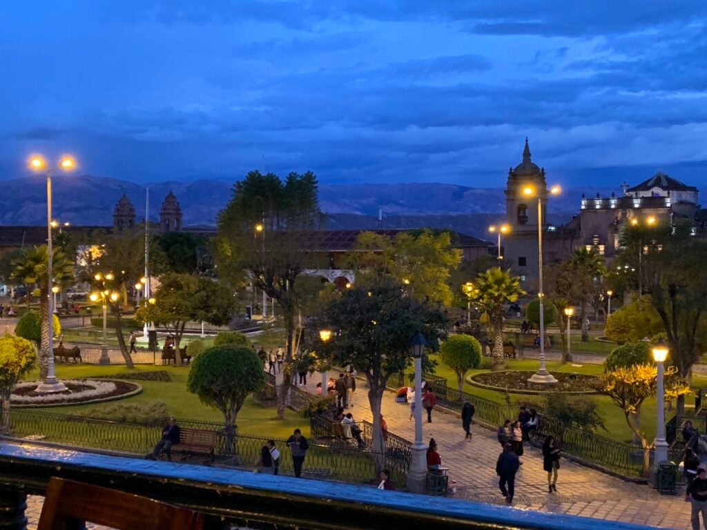 Plaza lit up at dusk in Ayacucho, Peru